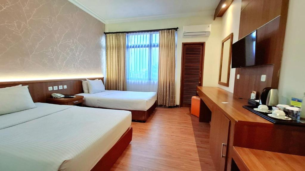 Voodi või voodid majutusasutuse MMUGM Hotel toas