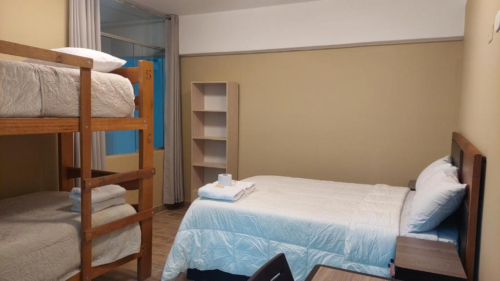 Postel nebo postele na pokoji v ubytování Lonko Central