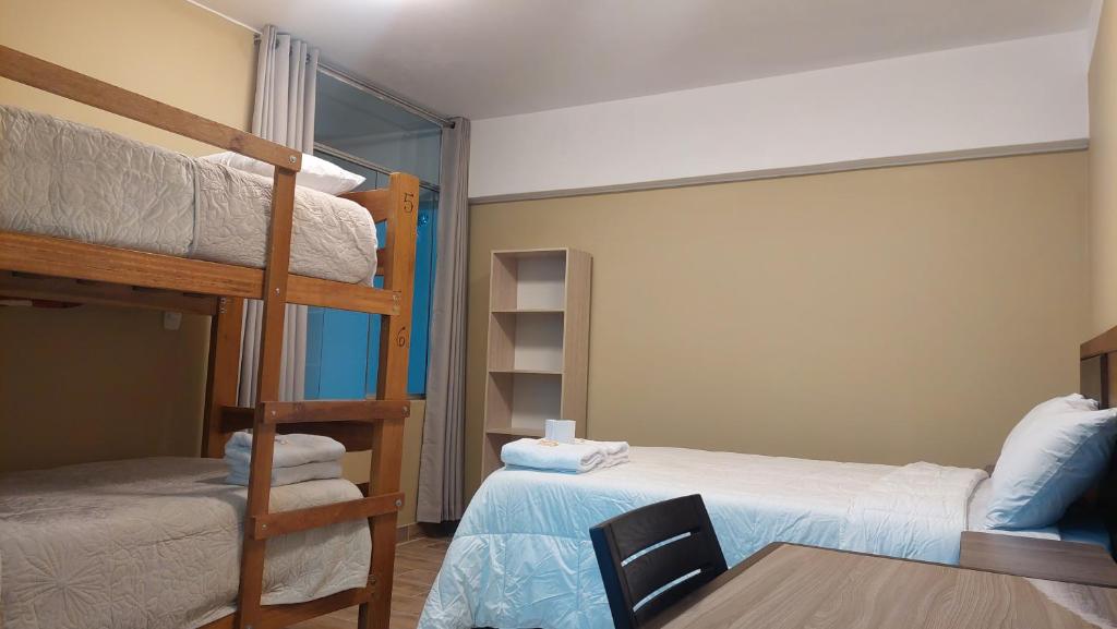 Postel nebo postele na pokoji v ubytování Lonko Central