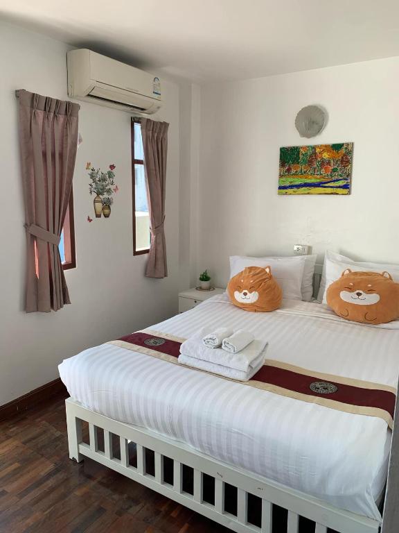 Postel nebo postele na pokoji v ubytování Tong Mee House Hua Hin