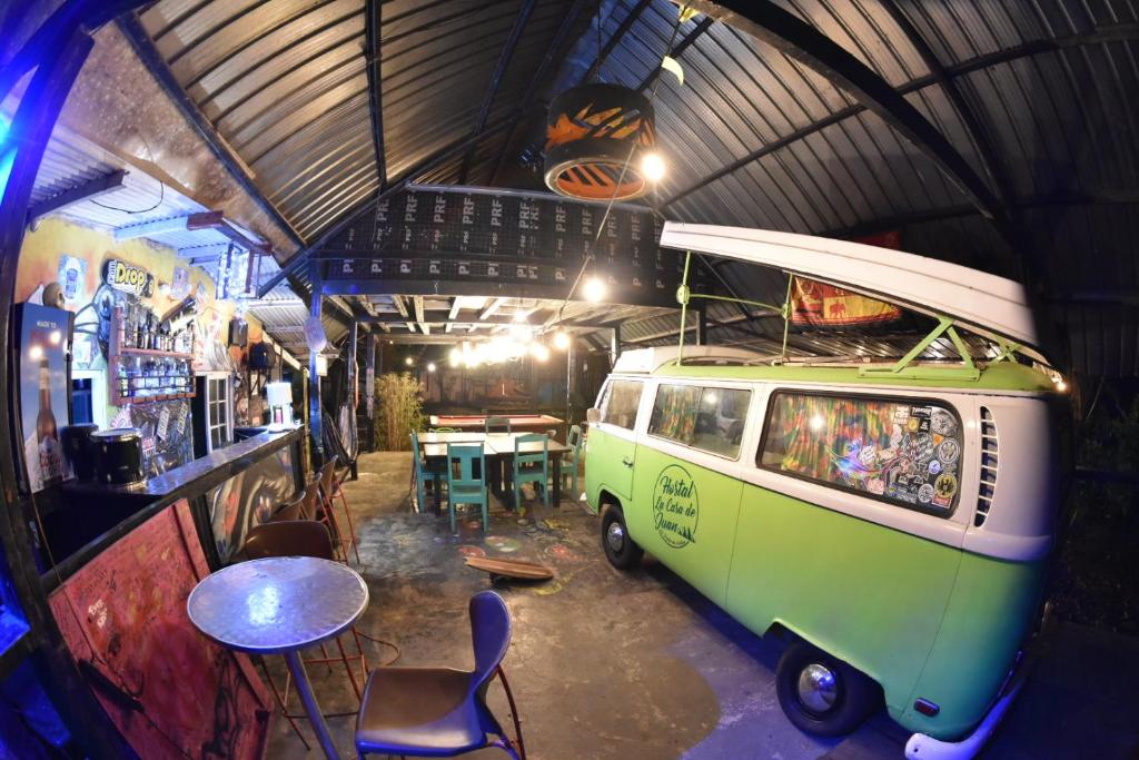 a green van parked in a room with a table at Hostal La Casa de Juan in Valle de Anton