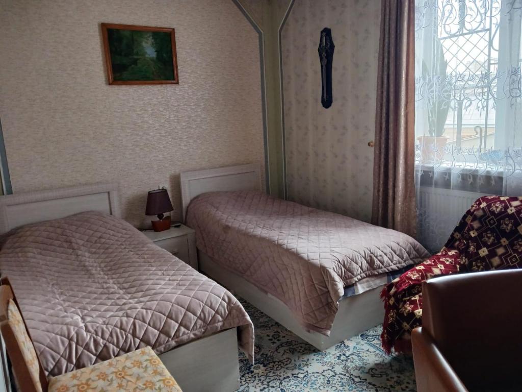 Postel nebo postele na pokoji v ubytování Norik's Guest House
