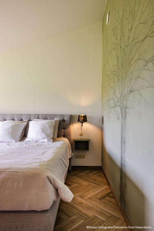 Postel nebo postele na pokoji v ubytování Op 't Roth 12 ruime sfeervolle vakantiewoning in 't groen