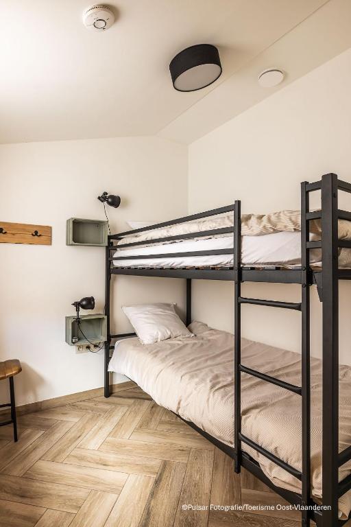 Postel nebo postele na pokoji v ubytování Op 't Roth 12 ruime sfeervolle vakantiewoning in 't groen