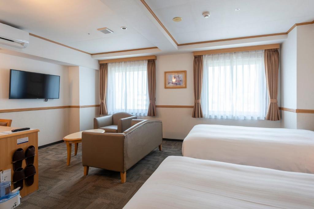 Postel nebo postele na pokoji v ubytování Toyoko Inn Daejeon Government Complex