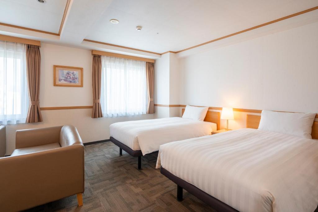 Postel nebo postele na pokoji v ubytování Toyoko Inn Daejeon Government Complex
