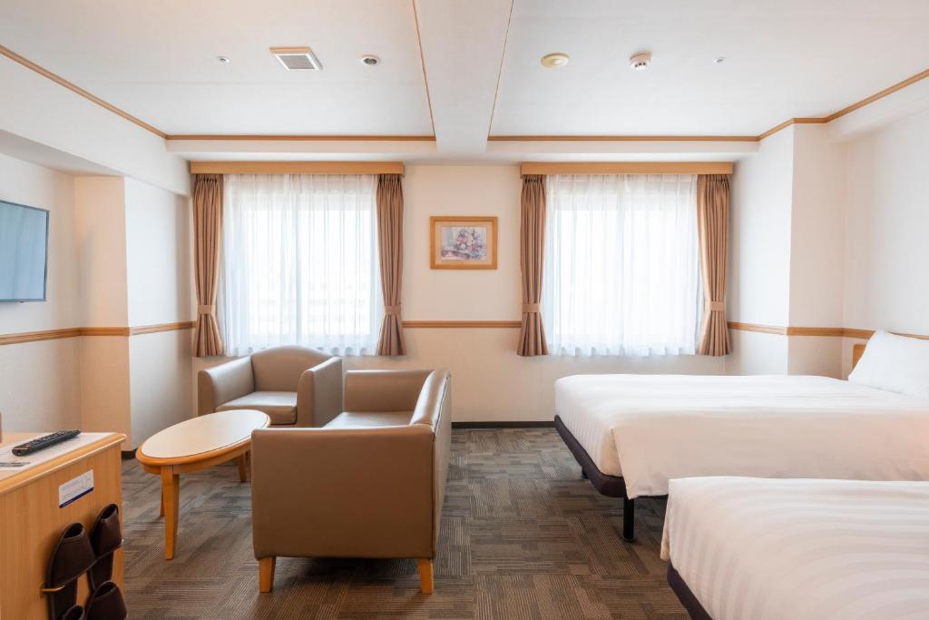 Postel nebo postele na pokoji v ubytování Toyoko Inn Daejeon Government Complex