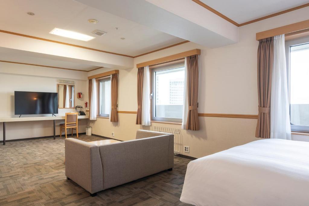 Postel nebo postele na pokoji v ubytování Toyoko Inn Daejeon Government Complex