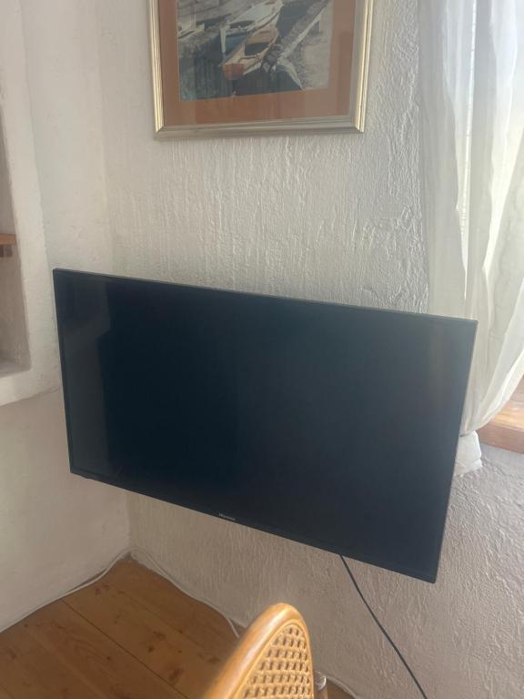 Televízia a/alebo spoločenská miestnosť v ubytovaní Apartment Dalmatera