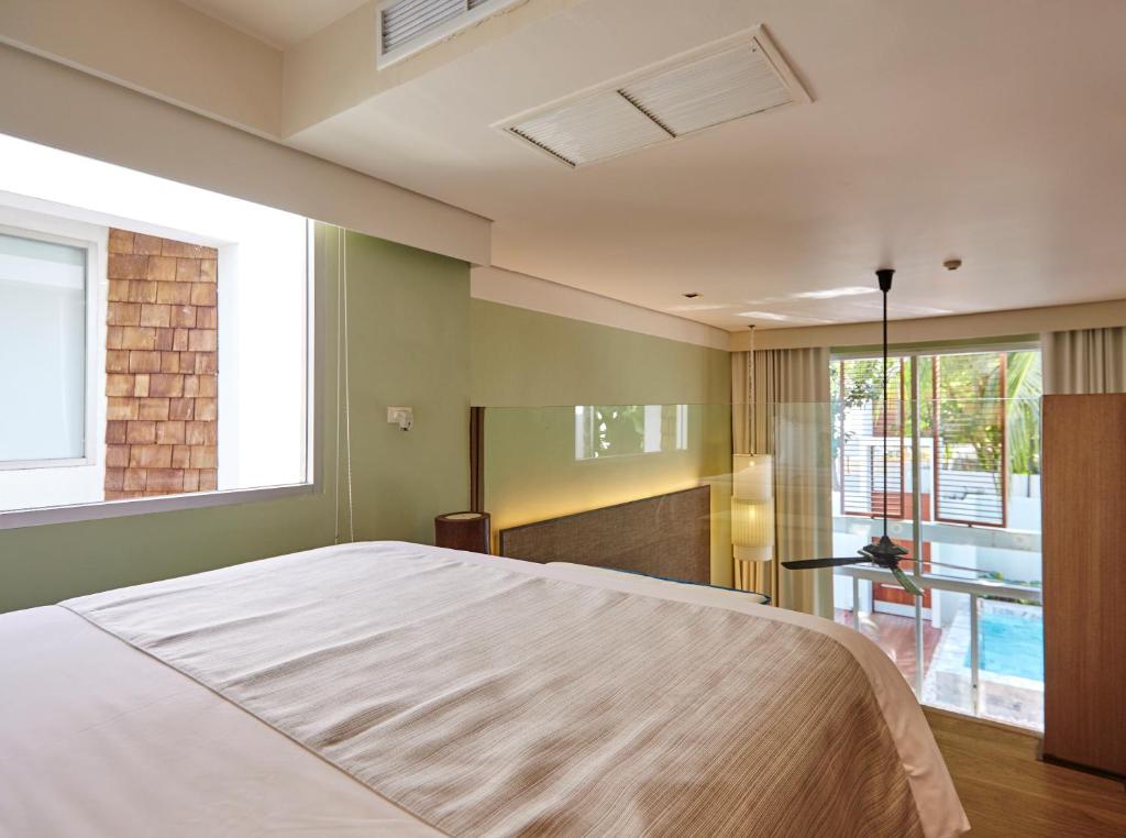 Postel nebo postele na pokoji v ubytování Veranda Pool Villas & Suite