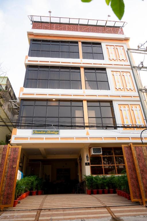 a tall building with a lot of windows at Hotel Chandan Heritage in Bhubaneshwar