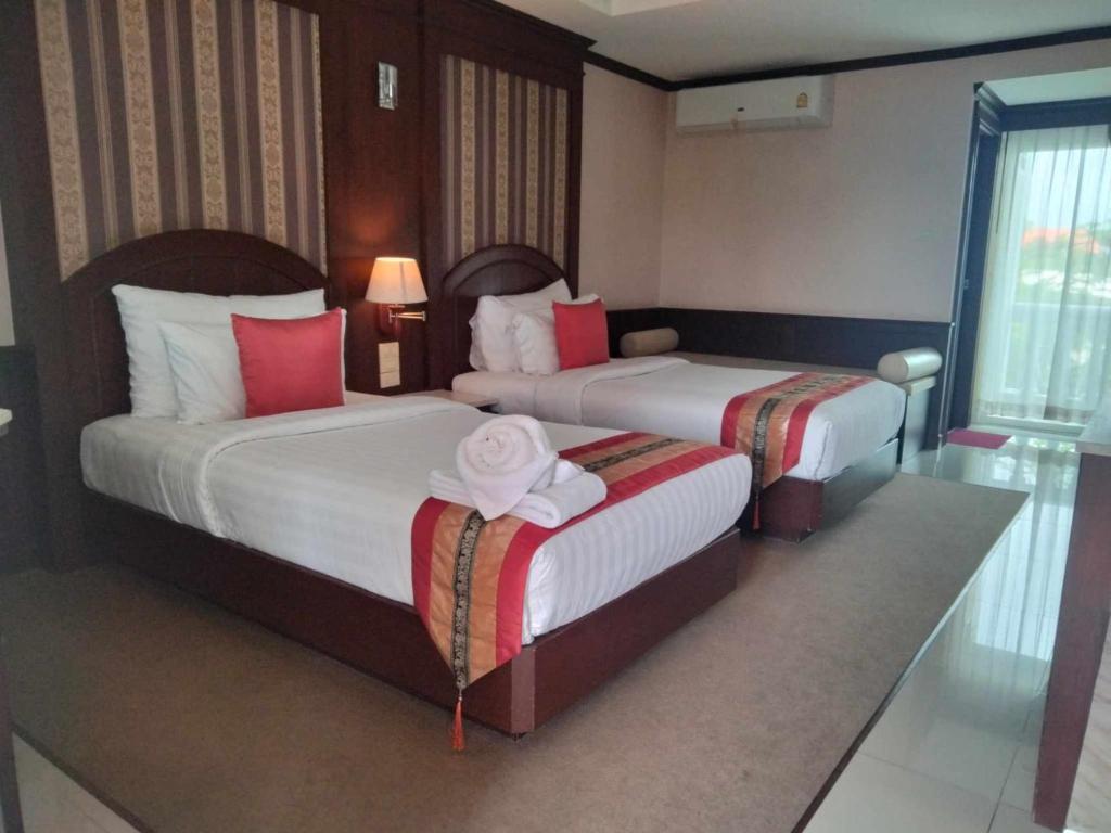 Cama o camas de una habitación en The Lion King Hotel Udonthani