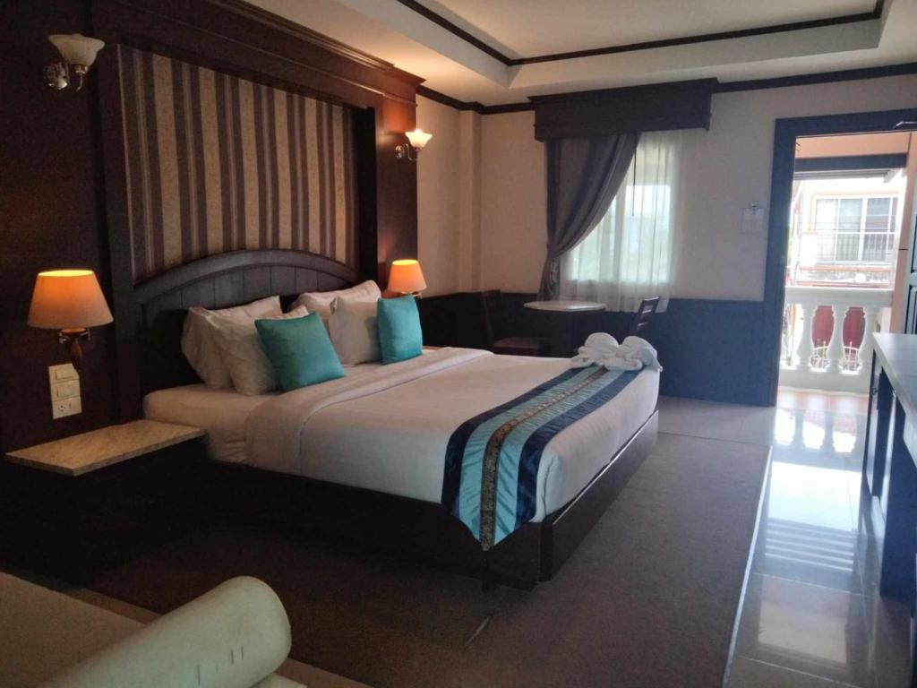 Cama o camas de una habitación en The Lion King Hotel Udonthani