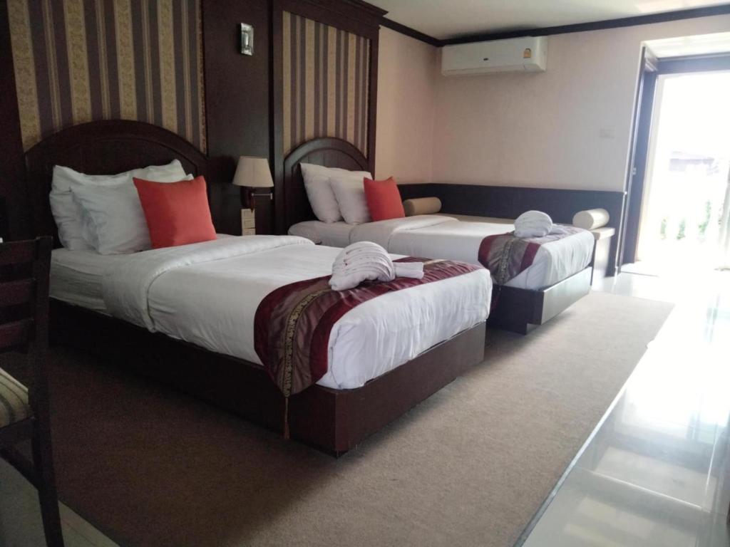 Cama o camas de una habitación en The Lion King Hotel Udonthani