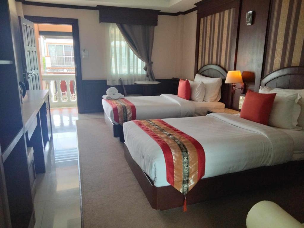 Cama o camas de una habitación en The Lion King Hotel Udonthani