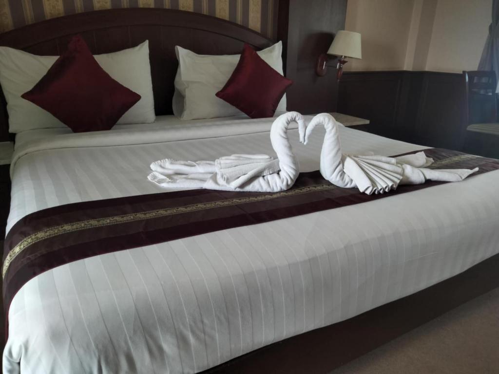 Cama o camas de una habitación en The Lion King Hotel Udonthani