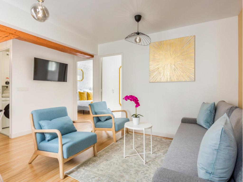 TV a/nebo společenská místnost v ubytování Merveil - Family Suite - Marais - Martin V
