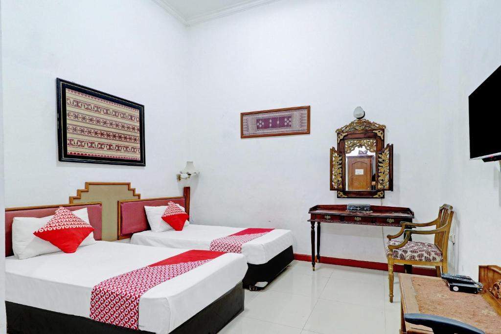 Voodi või voodid majutusasutuse Hotel O Bandung near Stadion Siliwangi formerly The Ethnic Hotel Bandung toas