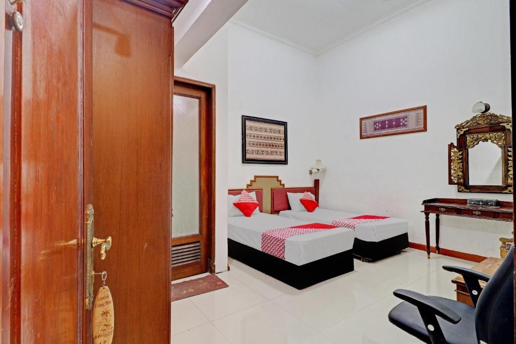 Voodi või voodid majutusasutuse Hotel O Bandung near Stadion Siliwangi formerly The Ethnic Hotel Bandung toas
