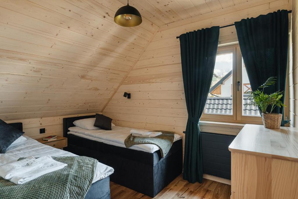 Postel nebo postele na pokoji v ubytování Czorsztyn View Chalets