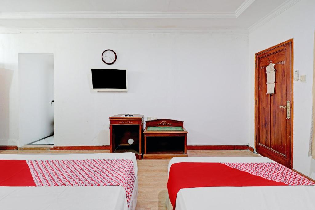 Voodi või voodid majutusasutuse Hotel O Bandung near Stadion Siliwangi formerly The Ethnic Hotel Bandung toas