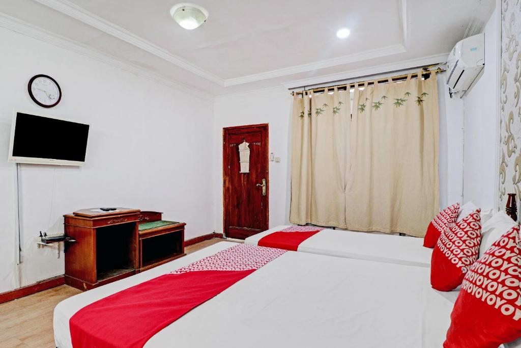 Voodi või voodid majutusasutuse Hotel O Bandung near Stadion Siliwangi formerly The Ethnic Hotel Bandung toas