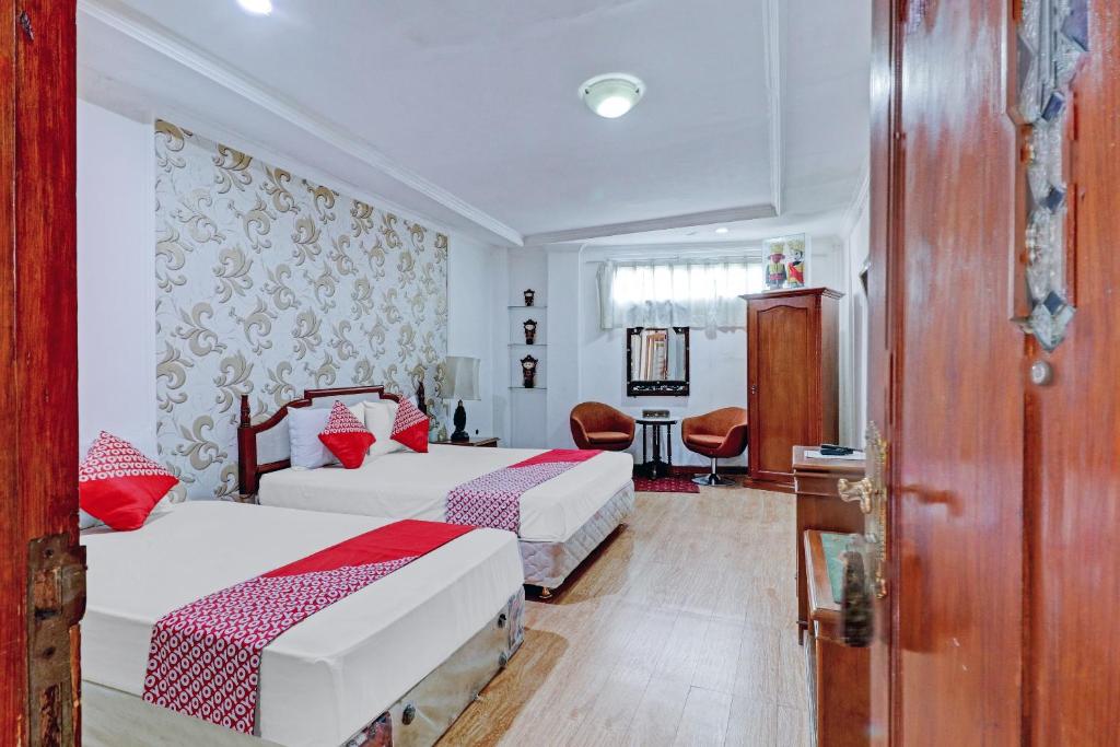 Voodi või voodid majutusasutuse Hotel O Bandung near Stadion Siliwangi formerly The Ethnic Hotel Bandung toas