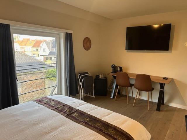 TV a/nebo společenská místnost v ubytování Guesthouse Orchid