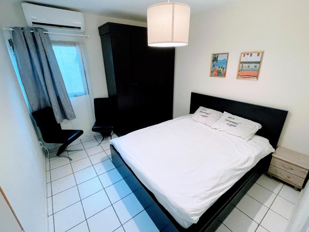 מיטה או מיטות בחדר ב-Apartments Lev Eilat 8