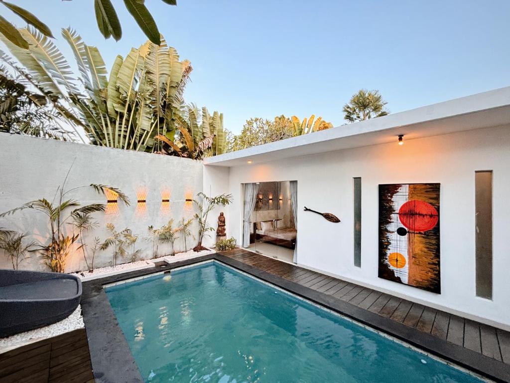 a swimming pool in the backyard of a house at Modern 2 BR villa seminyak center. in Seminyak