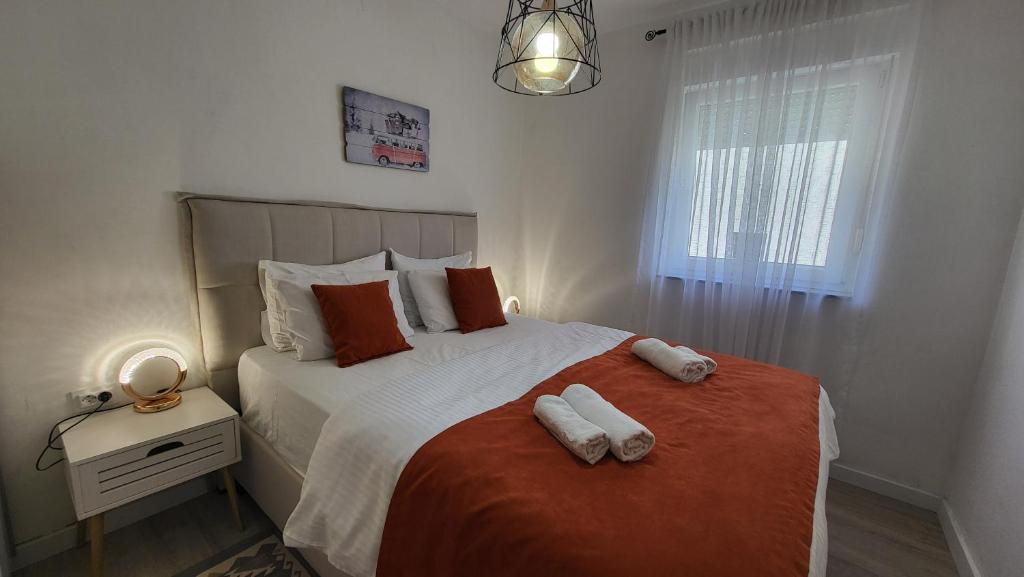 Postel nebo postele na pokoji v ubytování Apartments Teodo