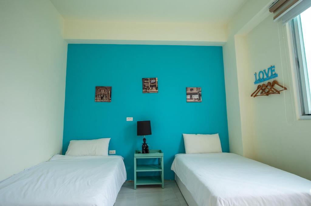 Posteľ alebo postele v izbe v ubytovaní Ding Shian B&B