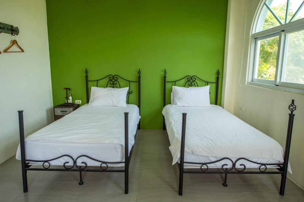 Posteľ alebo postele v izbe v ubytovaní Ding Shian B&B