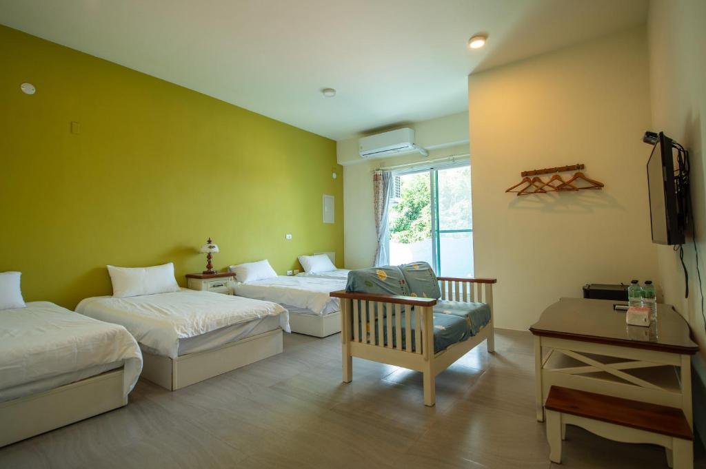 Posteľ alebo postele v izbe v ubytovaní Ding Shian B&B