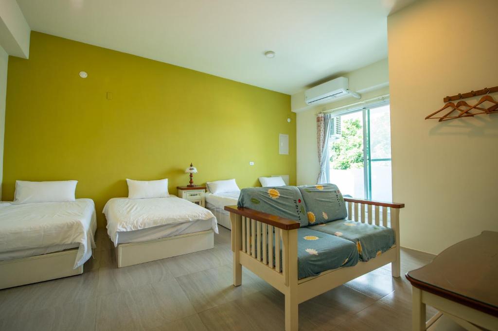 Posteľ alebo postele v izbe v ubytovaní Ding Shian B&B