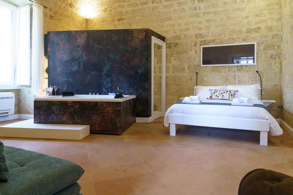 Postel nebo postele na pokoji v ubytování Bue Marino Suite