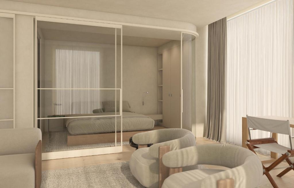 a bedroom with a bed and a living room at Infinity Hotel & More in Budva