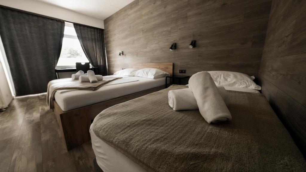 Postel nebo postele na pokoji v ubytování Hotel Matija Gubec