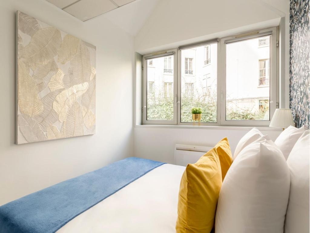 Posteľ alebo postele v izbe v ubytovaní Merveil - Family Suite - Tour Eiffel - Viala I