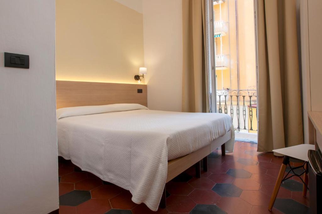 Postel nebo postele na pokoji v ubytování Hotel Palace