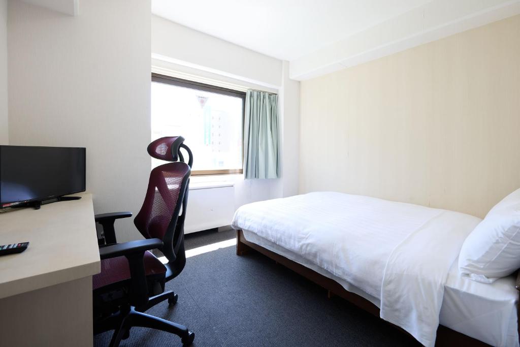 TV a/nebo společenská místnost v ubytování Tabist HotelArflex Tokuyama Station