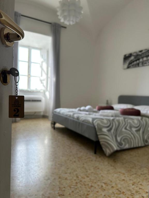 Ένα ή περισσότερα κρεβάτια σε δωμάτιο στο Alloggio Turistico l'Aurora