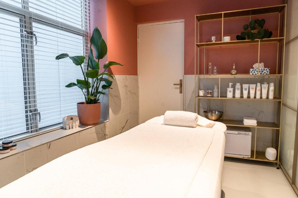 Postel nebo postele na pokoji v ubytování Hotel Haarhuis
