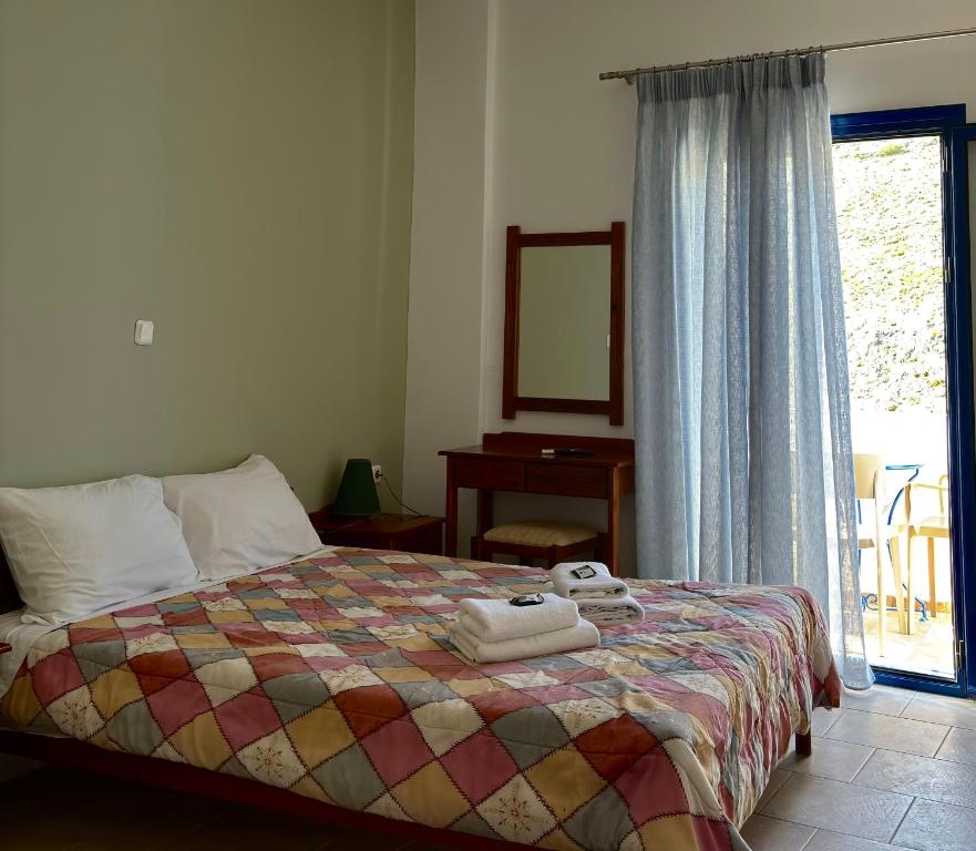 A bed or beds in a room at Mesohori studios