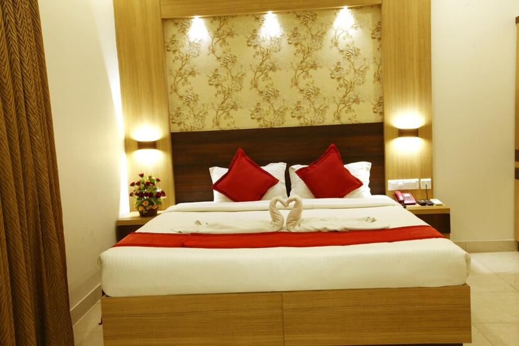 Postel nebo postele na pokoji v ubytování Prayana Hotels