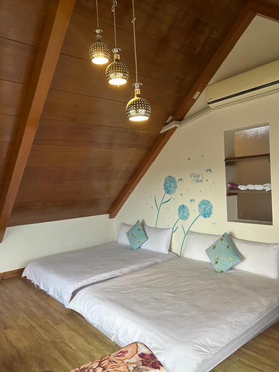 Postel nebo postele na pokoji v ubytování Xian Qing Yu Zhi Homestay