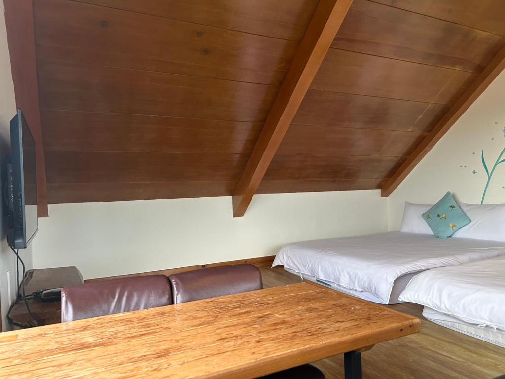 Postel nebo postele na pokoji v ubytování Xian Qing Yu Zhi Homestay