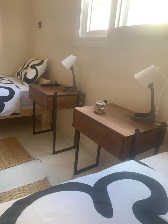 Postel nebo postele na pokoji v ubytování Al Mohit Hôtel Dakhla