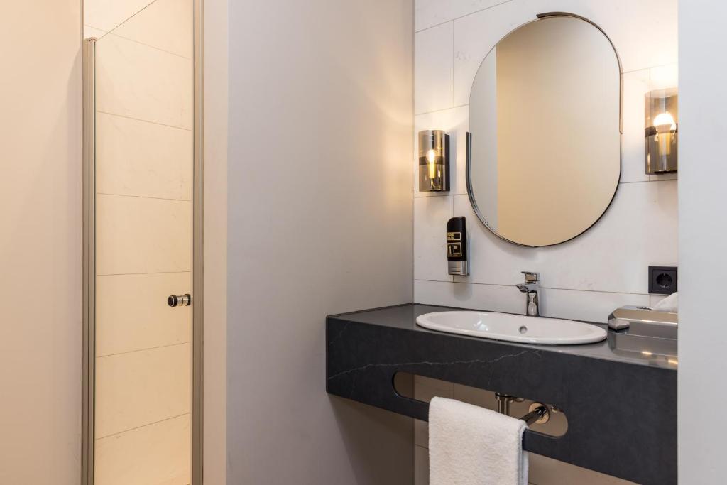 Koupelna v ubytování MERICI Hotel Sittard