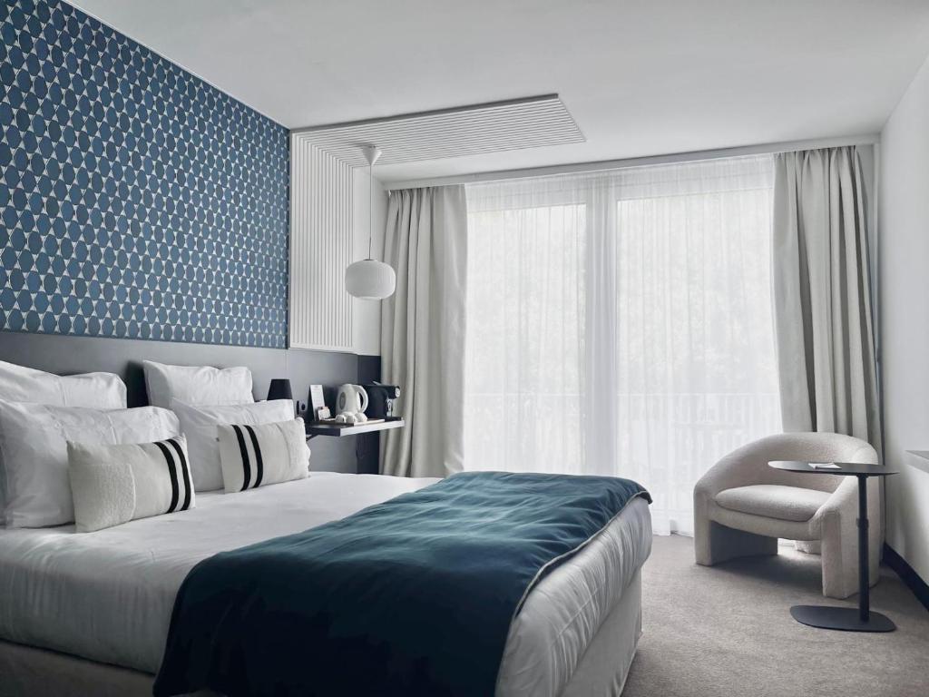 Postel nebo postele na pokoji v ubytování Le Prose Hôtel